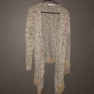 gray cardigans with lace material on bottom